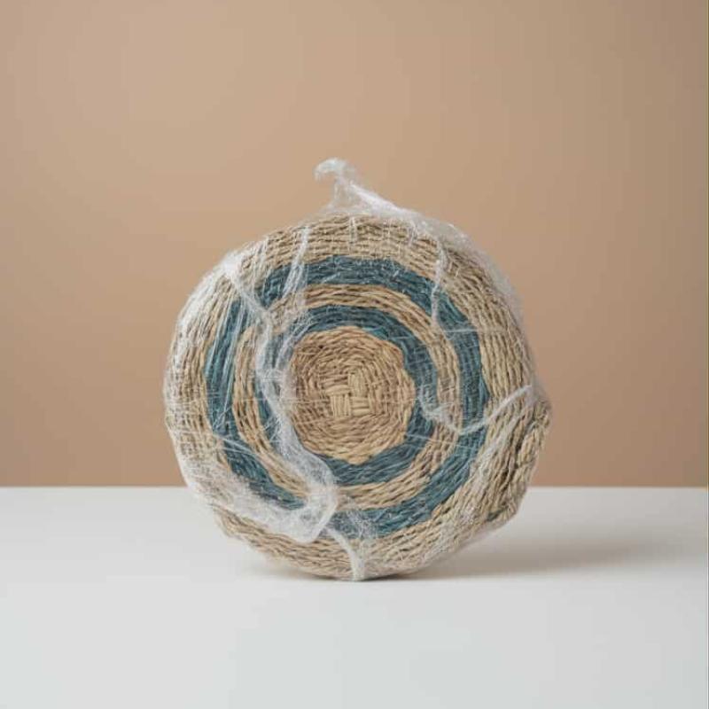 Woven circle sling bag
